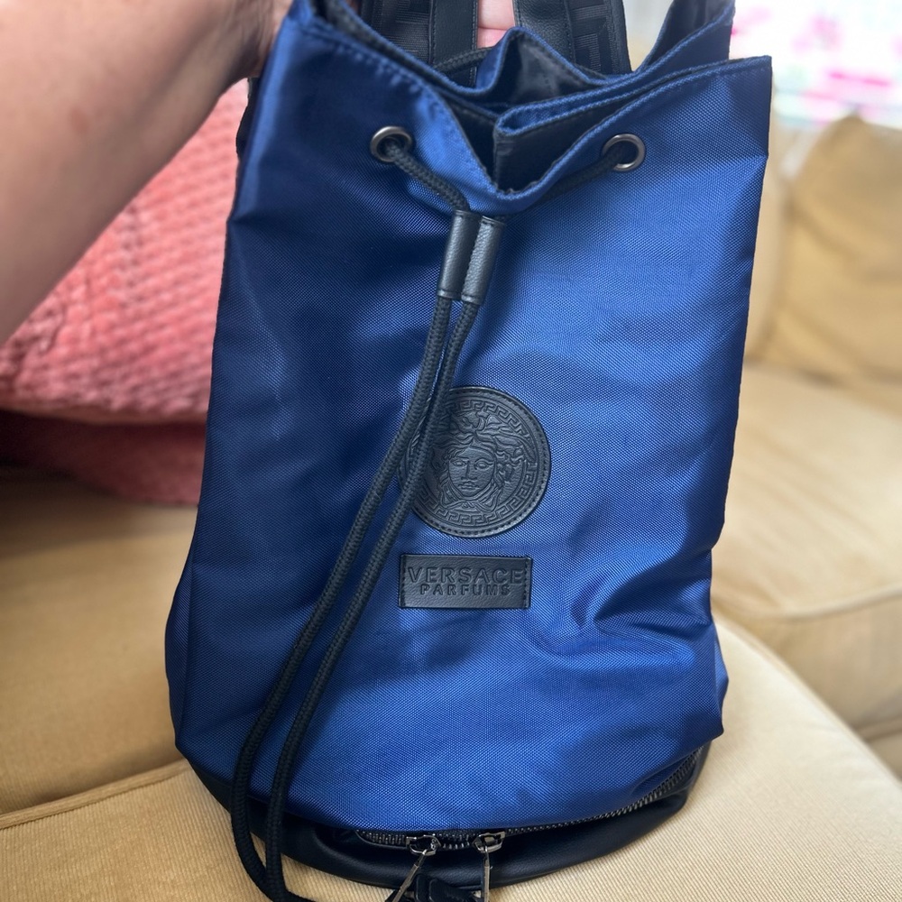 Versace Parfums bucket bag with shoulder straps. Blue with leather trim.